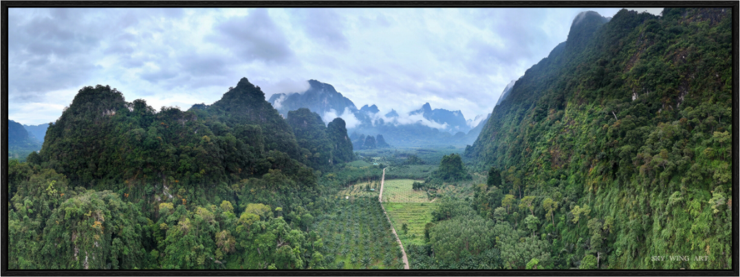 Main image Stone Guardians – Rainlight Over Khlong Phanom, Surat Thani